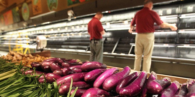 BOSTON - APRIL 23: Employees prepare the produce section for the opening of the new Wegmans opens in Boston. (Photo by Suzanne Kreiter/The Boston Globe via Getty Images)