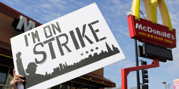 McDonald's workers and supporters rally outside a McDonald's, Wednesday, April 15, 2015, in Chicago. Fast-food workers calling for $15 an hour are picking up some more allies Wednesday. Airport workers, home care workers, Walmart workers and adjunct professors are among those set to join in the fight for $15 protests across the country, in what organizers are calling the biggest ever mobilization of workers in the U.S. (AP Photo/M. Spencer Green)