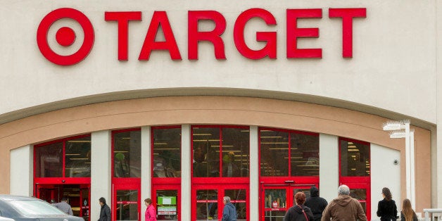 FILE - In this Dec. 19, 2013, file photo, shoppers arrive at a Target store in Los Angeles. Target has proposed to pay $10 mi