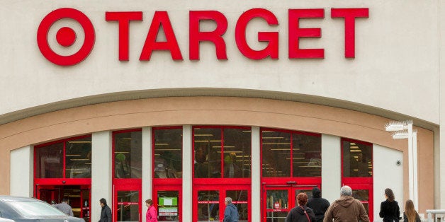 FILE - In this Dec. 19, 2013, file photo, shoppers arrive at a Target store in Los Angeles. Target has proposed to pay $10 million to settle a class-action lawsuit brought against it following a massive data breach in 2013. (AP Photo/Damian Dovarganes, File)