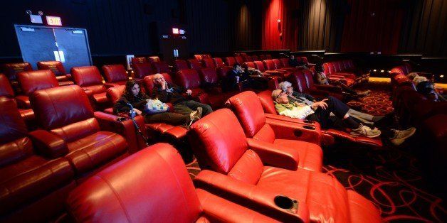 TO GO WITH AFP STORY US-ENTERTAINMENT-CINEMAPatrons enjoy a movie while seated in reclining chairs, at the newly redesigned AMC theatre on Broadway at 84th Street, in New York, October 21, 2013. The theatre is the first in Manhattan to offer it customers luxurious reclining chair seating. AFP PHOTO/Emmanuel Dunand (Photo credit should read EMMANUEL DUNAND/AFP/Getty Images)