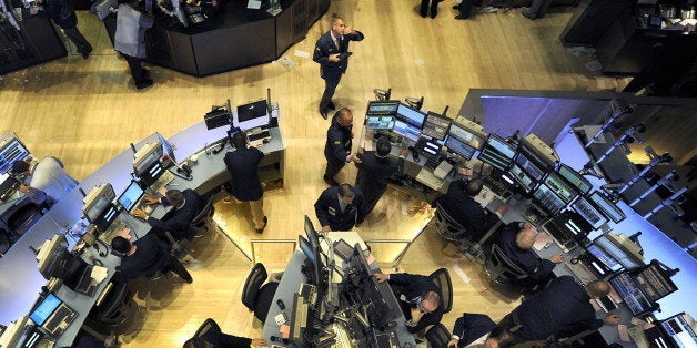 (FILES) File photograph dated May 6, 2010 shows traders on the floor of the New York Stock Exchange looking at stocks during