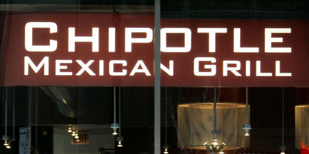 **FILE** Diners are seen through the front window of a Chipotle Mexican Grill restaurant in this Jan. 24, 2007 file photo, in downtown Chicago. Chipotle Mexican Grill is expected to release quarterly earnings on Thursday, Feb. 15, 2007. (AP Photo/M. Spencer Green, file)