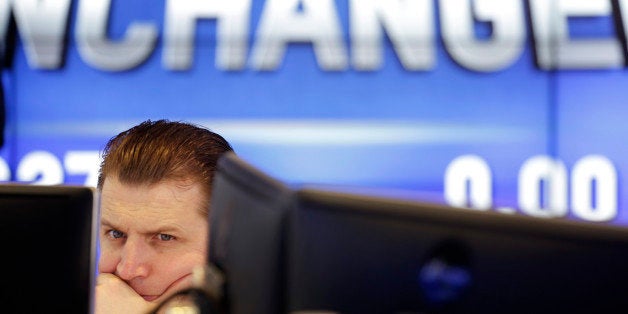 A specialist at the Nasdaq MarketSite monitors the pricing of Inovalon during its IPO, Thursday, Feb. 12, 2015 in New York. (AP Photo/Mark Lennihan)