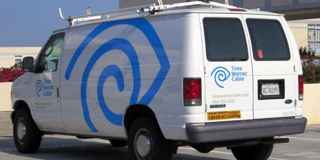 2007 (?) Ford E-250 van with Time Warner Cable's new livery. Gone are the plugs for TWC's various services, replaced by enlarged eye/ear emblems.