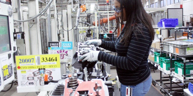 In this Nov. 20, 2014 photo Alana Sutton works on an engine at a Harley-Davidson plant in Menomonee Falls, Wis. Milwaukee-based Harley-Davidson is among the companies targeting women to help fill manufacturing jobs. (AP Photo/Carrie Antlfinger)