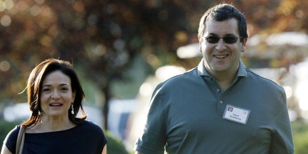 FILE - In this July 10, 2013 file photo, Sheryl Sandberg, COO of Facebook, left, and her husband David Goldberg, CEO of Surve