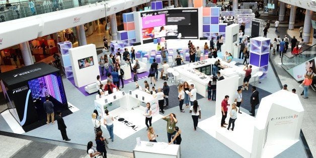 LONDON, ENGLAND - SEPTEMBER 20: Shoppers and 'Hackers' attend a 24 hour Fashion 'Hackathon' to celebrate the launch of Westfield Autumn Winter 2014 fashion at The Atrium, Westfield on September 20, 2014 in London, England.60 participants split into teams will work through the night, mentored by leading industry influencers from Fashion and Technology. (Photo by Stuart C. Wilson/Getty Images for Westfield)