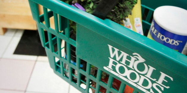 In this photo taken Tuesday, May 11, 2010, a woman carries a basket at a Whole Foods Market, Inc., store in Little Rock, Ark. Whole Foods Market Inc. reports quarterly earnings, Wednesday, May 12, 2010, after the market closes. (AP Photo/Danny Johnston)