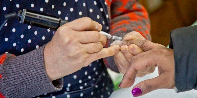 FILE - In this Jan. 8, 2015 file photo, a customer receives a manicure at a nail salon in New York. Gov. Andrew Cuomo said on Monday May 11, 2015, that he was creating a task force to investigate nail salons and crack down on worker abuse following a report of widespread exploitation and health problems of manicurists. A two-part investigative series in The New York Times found nail salon workers were forced to toil long hours amid toxic chemicals performing manicures and pedicures for little wages. The stories also reported many workers suffered serious health problems and there was little, if any, protection for them. (AP Photo/Bebeto Matthews, File)