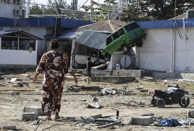 Houses and vehicles damaged by earthquake and tsunami are seen on Talise beach area, Palu, Central Sulawesi.