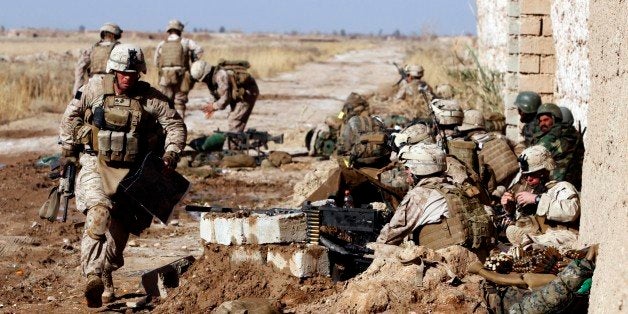 A Marine with Weapons Platoon, Charlie Company, 1st Battalion, 3rd Marine Regiment, sprints down the line of heavy machine guns to deliver a map after a firefight with Taliban insurgents, Feb. 9, at the "Fire Points" intersection, a key junction of roads linking the northern area of the insurgent stronghold of Marjeh with the rest of Helmand province. Marines of Charlie Company conducted a helicopter-borne assault earlier that morning to seize the area. RCS2010Regimental Combat Team-7, 1st Marine Division Public Affairs Photo by Sgt. Brian Tuthill Date: 02.09.2010Location: HELMAND PROVINCE, AFRelated News and Photos: dvidshub.net/r/4d6o7m