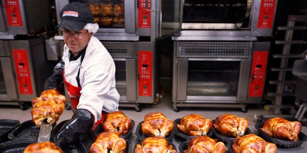 FILE - In this file photograph made March 3, 2010, a Costco employee cooks chicken at Costco in Mountain View, Calif. A private trade group says the service sector expanded in April, but at a slower pace than expected. (AP Photo/Paul Sakuma, file)