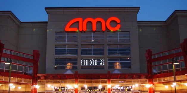 ** ADVANCE FOR WEEKEND, MAY 14-15 ** People enter AMC's Studio 30 theater in Olathe, Kan., Wednesday, May 11, 2005. Defined as having 14 or more screens and modern amenities like stadium-style seating, the megaplex idea of marketing movies will turn ten years old this week. AMC Entertainment Inc. opened the first, the Grand 24 in Dallas, on May 19, 1995. (AP Photo/Orlin Wagner)