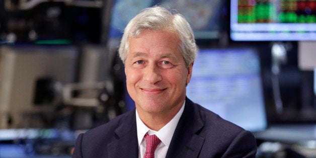 FILE - In this July 12, 2013 file photo, JP Morgan Chase Chairman and CEO Jamie Dimon is interviewed on the floor of the New