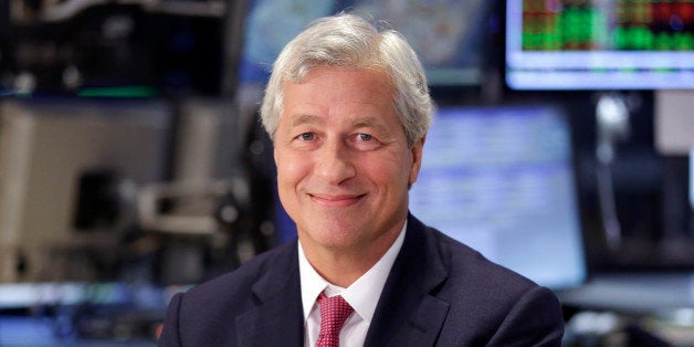 FILE - In this July 12, 2013 file photo, JP Morgan Chase Chairman and CEO Jamie Dimon is interviewed on the floor of the New York Stock Exchange. JPMorgan said Friday, Oct. 25, 2013, that it has agreed to pay $5.1 billion to resolve claims that it misled Fannie Mae and Freddie Mac about risky mortgage securities it sold them before the housing market collapsed. (AP Photo/Richard Drew, File)