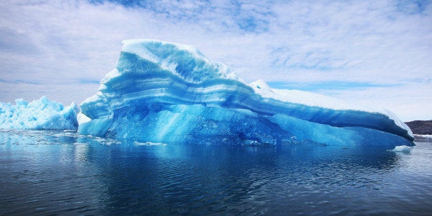 QAQORTOQ, GREENLAND - JULY 30: Calved icebergs from the nearby Twin Glaciers are seen floating on the water on July 30, 2013 in Qaqortoq, Greenland. Boats are a crucial mode of transportation in the country that has few roads. As cities like Miami, New York and other vulnerable spots around the world strategize about how to respond to climate change, many Greenlanders simply do what theyve always done: adapt. 'Were used to change, said Greenlander Pilu Neilsen. 'We learn to adapt to whatever comes. If all the glaciers melt, well just get more land. (Photo by Joe Raedle/Getty Images)