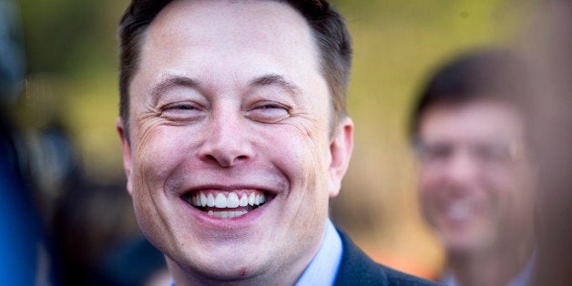 FILE - In this April 30, 2015, file photo, Tesla CEO Elon Musk speaks with members of the media at Tesla's headquarters in Pa