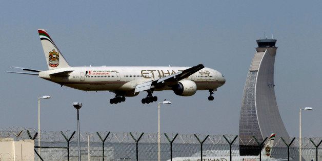 FILE - In this May 4, 2014 file photo, an Etihad Airways plane prepares to land at the Abu Dhabi airport in the United Arab Emirates. The United Arab Emirates' national carrier has formally submitted a document to the United States government rebutting allegations by U.S. carriers that it receives unfair subsidies. (AP Photo/Kamran Jebreili, File)