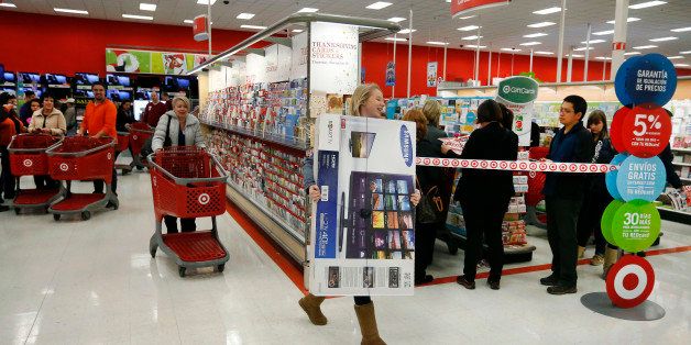 Shoppers look for deals shortly after the 6 pm Thanksgiving day sale opening of a Target store in Superior, Colo., on Thursday, Nov. 27, 2014. (AP Photo/Brennan Linsley)