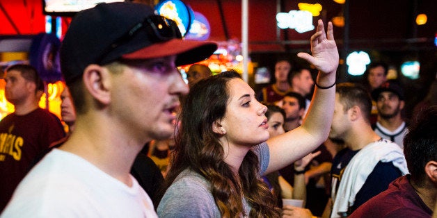 CLEVELAND, OH- JUNE 16: Cleveland Cavaliers fans react while watching Game 6 of the NBA Finals at Paninis Bar and Grill on June 16, 2015 in Cleveland, Ohio. The Golden State Warriors defeated The Cleveland Cavaliers 105-97 to win their first championship since 1975. (Photo by Angelo Merendino/Getty Images)