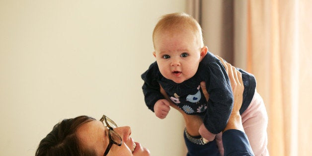 AUCKLAND, NEW ZEALAND - MAY 05: Secondary school teacher Sarah Ward at home on maternity leave with her three month old daughter Esme Kelliher, is in the last week of her paid parental leave allowance ahead of the New Zealand Federal Budget release, on May 5, 2015 in Auckland, New Zealand. New Zealand's Minister of Finance Bill English has announced that Budget 2015 will be presented on May 21, 2015. (Photo by Fiona Goodall/Getty Images)