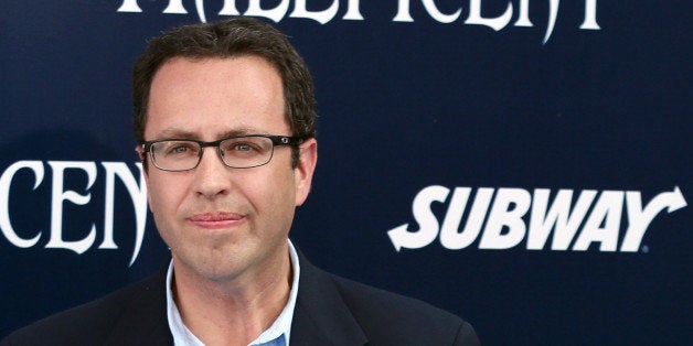 In this May 28, 2014 photo, Subway restaurant spokesman Jared Fogle arrives at the world premiere of "Maleficent" at the El Capitan Theatre in Los Angeles. FBI agents and Indiana State Police raided Fogle's Zionsville, Ind. home on Tuesday, July 7, 2015, removing electronics from the property and searching the house with a police dog. (Photo by Matt Sayles/Invision/AP)