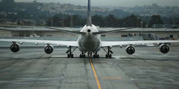 SAN FRANCISCO, CA - JUNE 10: A United Airlines plane sits on the tarmac at San Francisco International Airport on June 10, 2015 in San Francisco, California. The Environmental Protection Agency is taking the first steps to start the process of regulating greenhouse gas emissions from airplane exhaust. (Photo by Justin Sullivan/Getty Images)