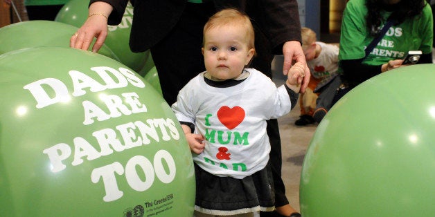 An unknown little girl is seen attending a meeting of the European Union Committee on Women's Rights and Gender Equality to support paternity leave legislation at the European Parliament in Brussels, Tuesday Feb.23, 2010. (AP Photo/Thierry Charlier)