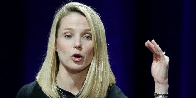 In this Feb. 19, 2015 photo, Yahoo President and CEO Marissa Mayer delivers the keynote address at the first-ever Yahoo Mobile Developer's Conference, in San Francisco. Mayer was the highest paid female CEO in 2014, according to a study carried out by executive compensation data firm Equilar and The Associated Press. (AP Photo/Eric Risberg)