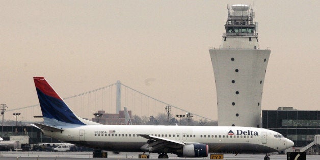 Delta flight departs from LaGuardia Airport in New York, Friday, April 14, 2006. Delta Air Lines Inc. and negotiators for its pilots union reached a tentative agreement Friday on long-term pay and benefit cuts that could avert a strike at the nation's third largest carrier and ease uncertainty among travelers over the busy holiday weekend. (AP Photo/Shiho Fukada)