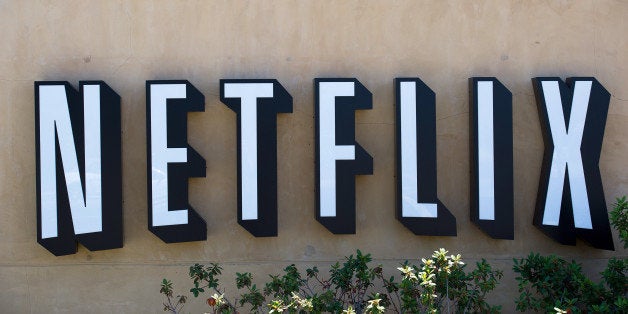 The Netflix Inc. logo is displayed at the entrance to the company's headquarters in Los Gatos, California, U.S., on Thursday,