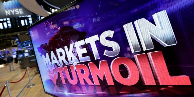 A television screen on the floor of the New York Stock Exchange, headlines market news, Monday, Aug. 24, 2015. World stock ma