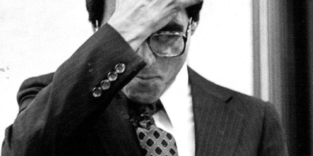 JUL 23 1983, JUL 27 1983; Federico Pena scratches his head while skimming through a pile of questions cards at a cards at a l