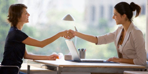 Businesswomen shaking hands