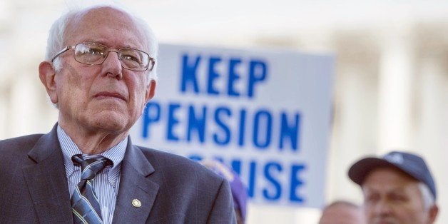 US Senate Budget Committee ranking member Senator Bernie Sanders (L), I-Vermont, speaks during a news conference to discuss legislation to restore pension guarantees for thousands of retired union workers, in front of the US Capitol in Washington, DC, June 18, 2015. AFP PHOTO/JIM WATSON (Photo credit should read JIM WATSON/AFP/Getty Images)