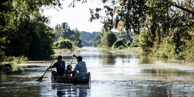 COLUMBIA, SC - OCTOBER 6: People canoe down South Beltline Road October 6, 2015 in Columbia, South Carolina. The state of South Carolina experienced record rainfall amounts over the weekend and officials expect the costs to be in the billions of dollars. (Photo by Sean Rayford/Getty Images)