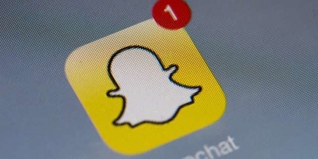 The logo of mobile app 'Snapchat' is displayed on a tablet on January 2, 2014 in Paris. Hackers broke into Snapchat, the huge