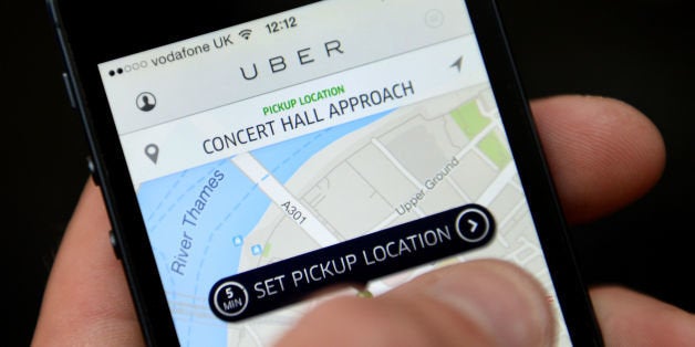 File photo dated 11/06/14 of the Uber app being used, as the taxi app lashed out against planned proposals affecting cab driv