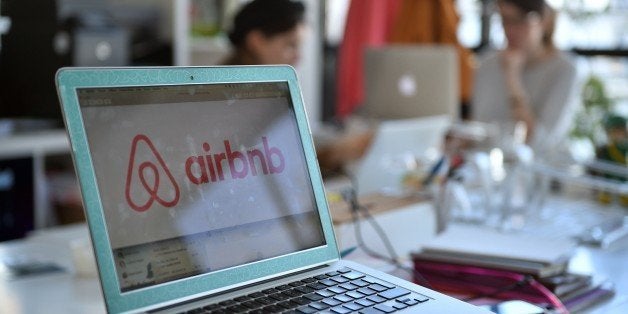 A picture shows the logo of online lodging service Airbnb displayed on a computer screen in the Airbnb offices in Paris on Ap