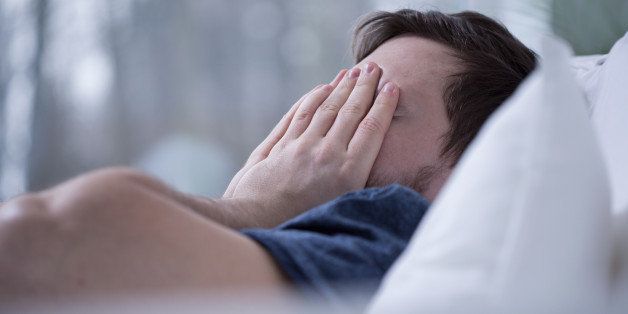Man having some sleeping disorders like insomnia