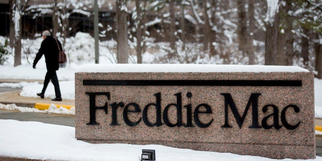A man walks into the Freddie Mac headquarters in McLean, Virginia, U.S., on Tuesday, March 18, 2014. Freddie Mac and Fannie M