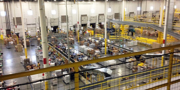 One of Amazon's newest distribution centers in Tracy, Calif., is seen during a tour Sunday, Nov. 30, 2014. This Amazon Fulfillment Center opened in 2013 and was refitted to use new robot technology in the summer of 2014. All year Amazon has been investing in ways to make shipping faster and easier to prepare for this holiday season. At this Northern California warehouse the company is employing robotics and other new technology to help workers process the annual onslaught of shopping orders. (AP Photo/Brandon Bailey)