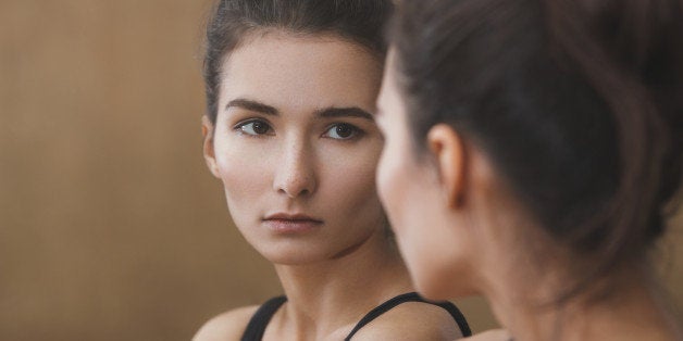 Beautiful woman in front of the mirror