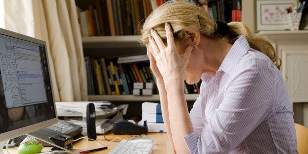 Stressed out woman in home office