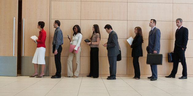 Businesspeople standing in line 