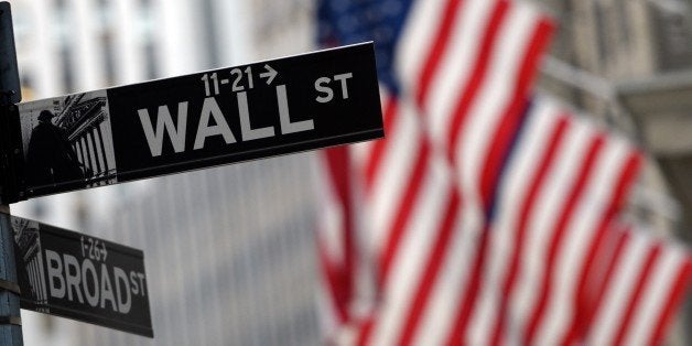 The corner of Wall and Broad Street across from the New York Stock Exchange after the closing bell January 7, 2016. US stocks