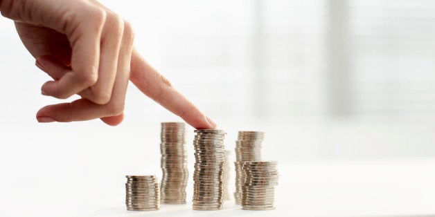 Womans finger on stack of coins