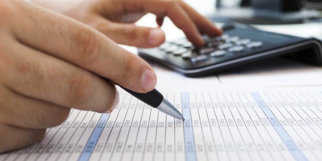 Accountant checking numbers on a document