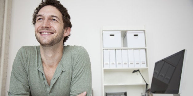 Caucasian businessman sitting at desk